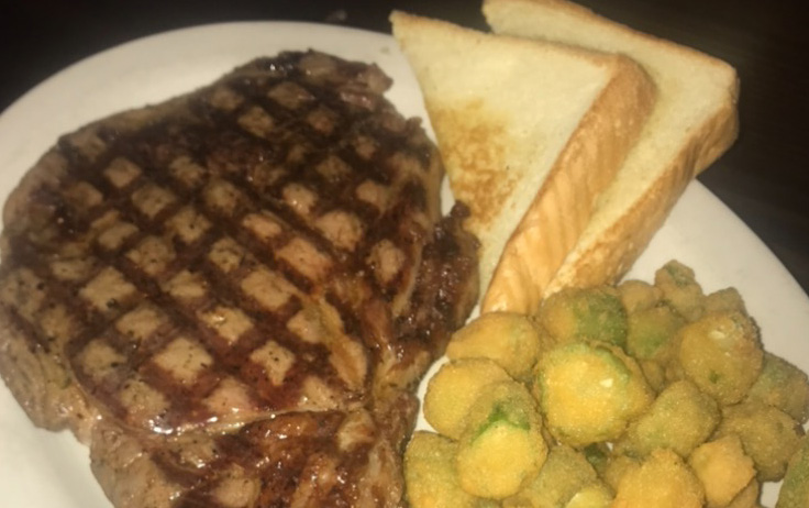 One of our juicy steaks with a side of okra and Texas toast